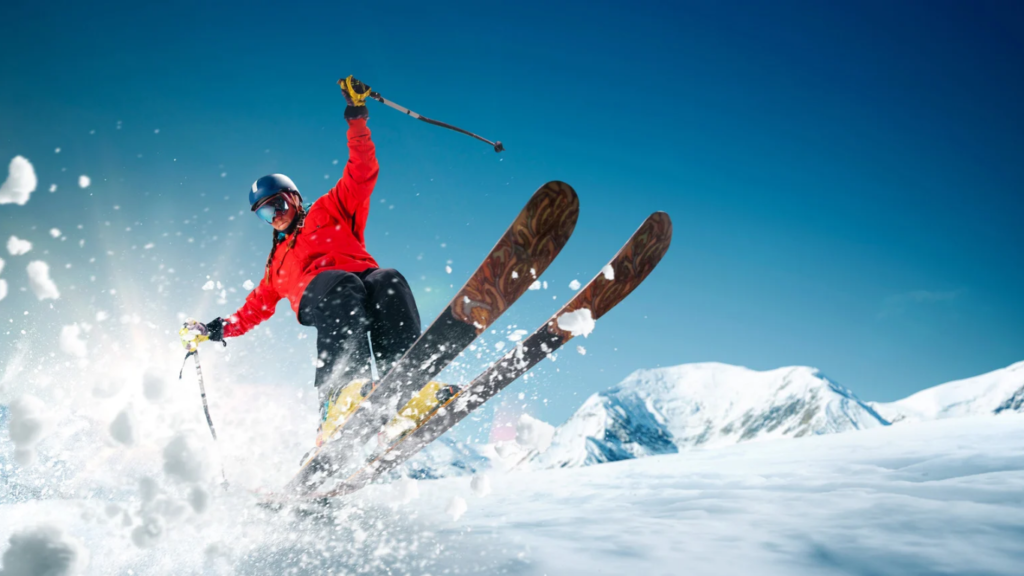 Mann der gerade Ski fährt